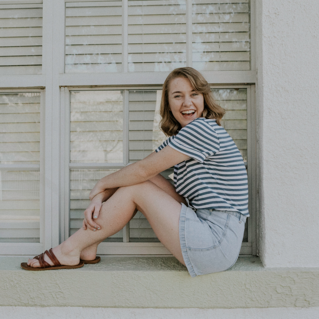 Teen girl sitting and smiling